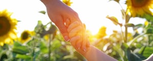 sunflowers_holding-hands_AdobeStock_377856522_copyright-Alekss_2500x500px